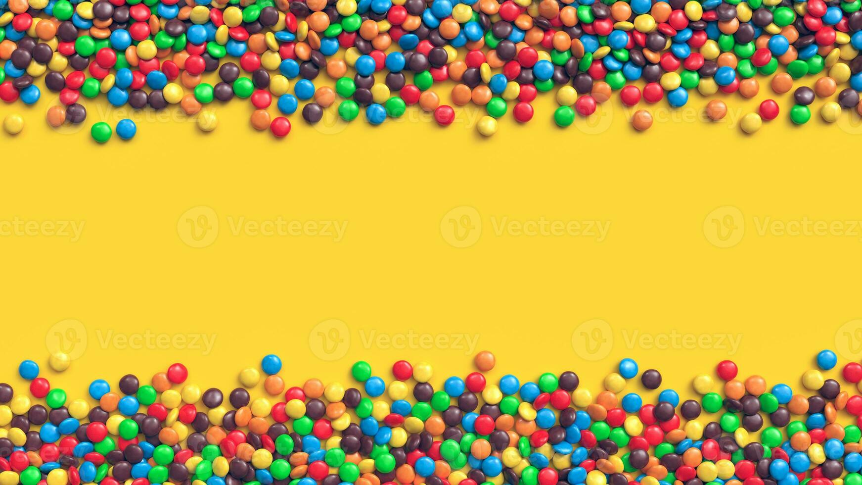 Double border of colorful coated chocolate candies on yellow background photo
