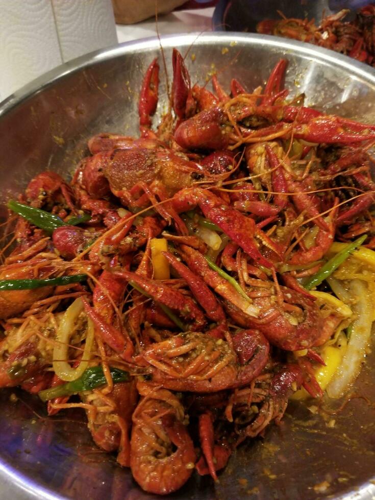 Stir fried crayfish with lemon and pepper in a pot photo