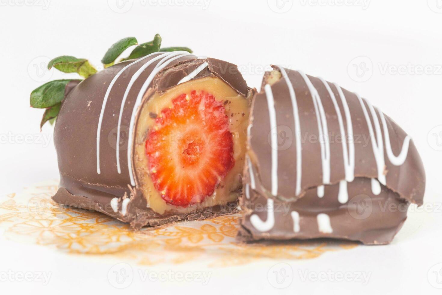 Strawberry Chocolate Covered Cake on white background, close up photo
