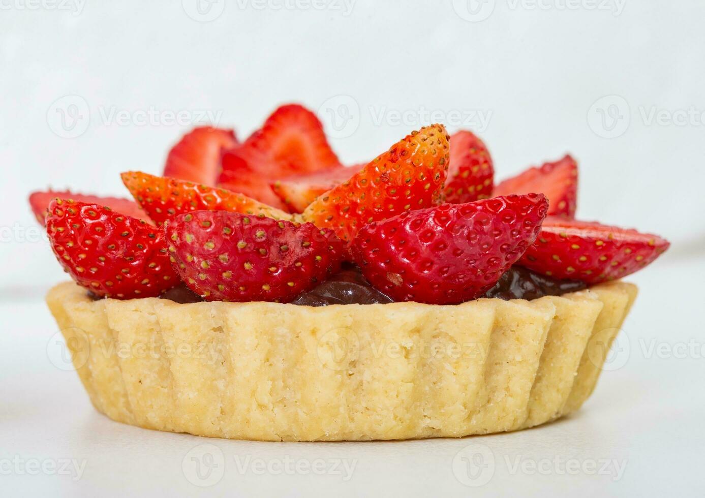 Strawberry tart on a white background. Selective focus. photo