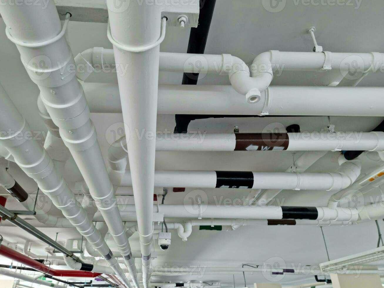 Pipes under the building for drainage systems and electrical pipes. photo