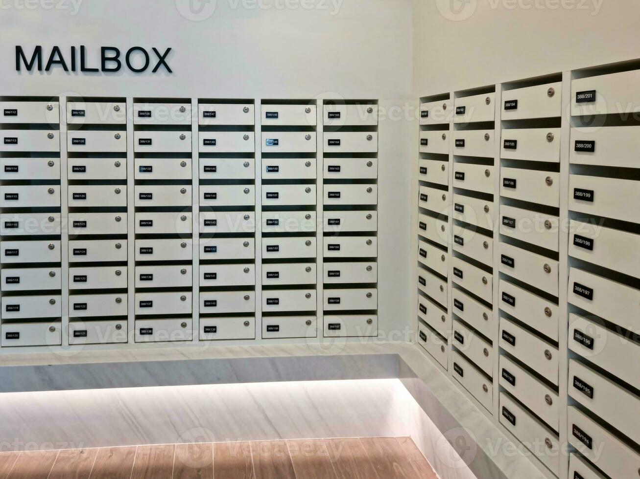Mailbox or post office full of numbers in an apartment building photo