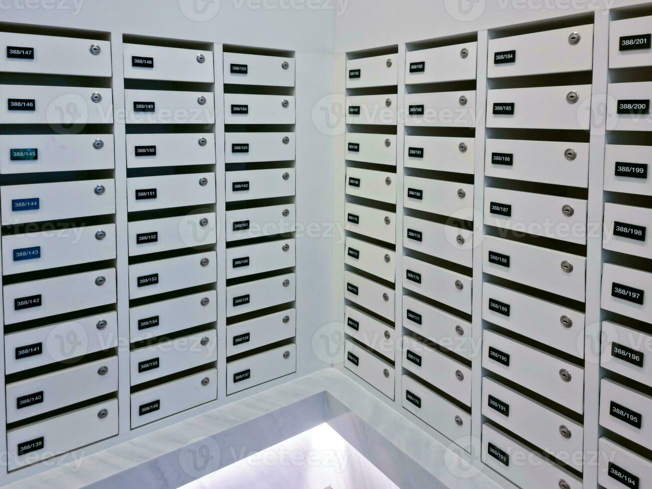 Mailbox or post office full of numbers in an apartment building photo