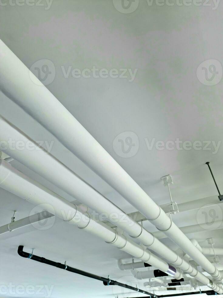 Pipes under the building for drainage systems and electrical pipes. photo