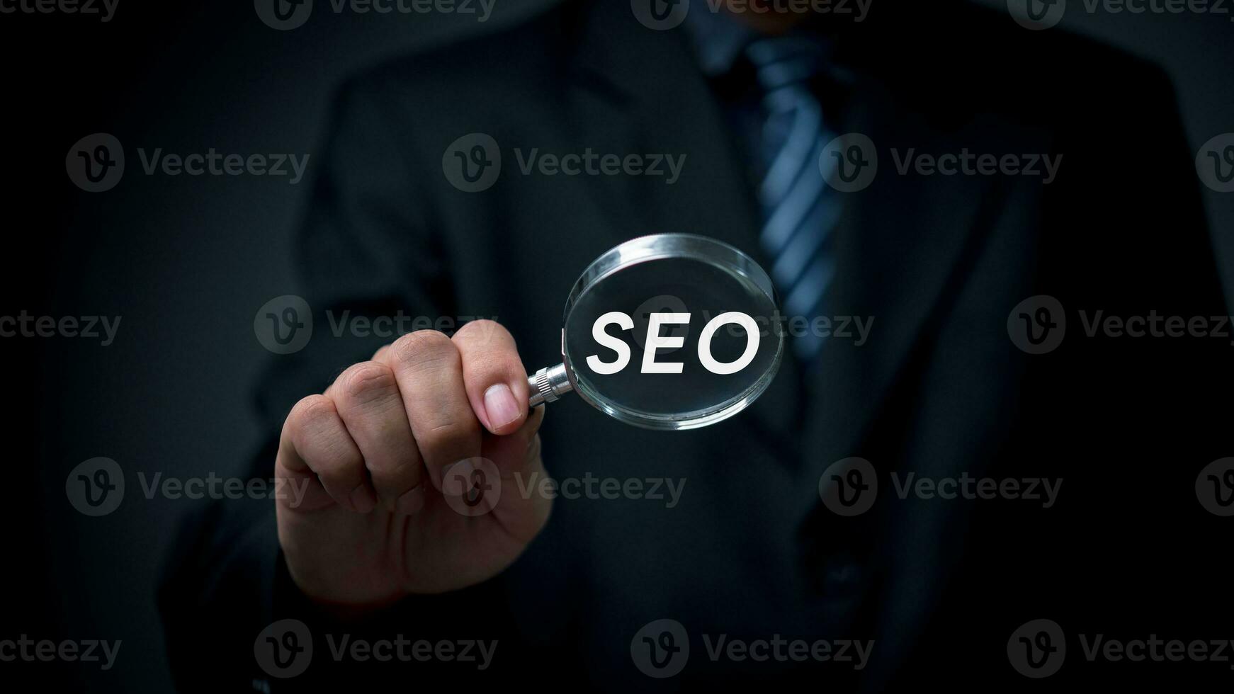 SEO Search Engine Optimization Strategy for Improved Web Traffic, Ranking and Sales Digital Marketing concept. Business Growth and Online Marketing.man holding through magnifying glass. photo