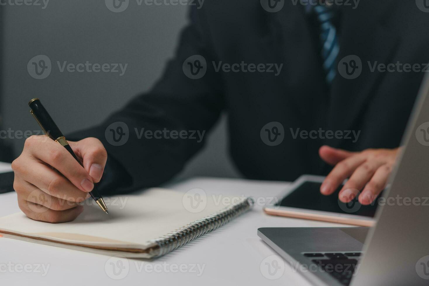 Hand holding pen checklist paper work on desk. Signing information contract and agreement. Checkbox report questions customer services. Write education and learning homework. photo