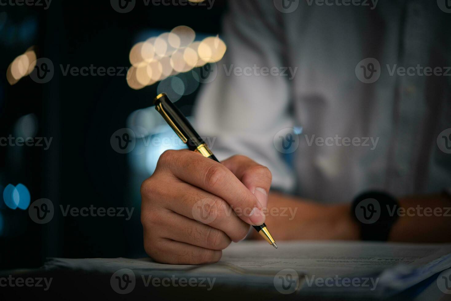 Hand holding pen checklist paper work on desk. Signing information contract and agreement. Checkbox report questions customer services. Write education and learning homework. photo