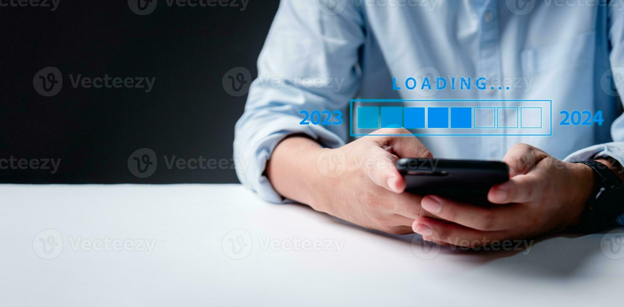 Loading progress bar fills up, symbolizing the transition from 2023 to 2024. Join us in this calendar date transformation, marking the end of one year and the exciting beginning of another. photo