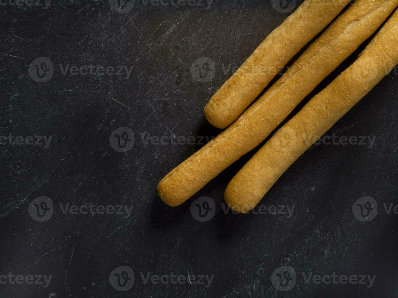 Grissini italian crunchy bread sticks lay flat isolated on studio. photo