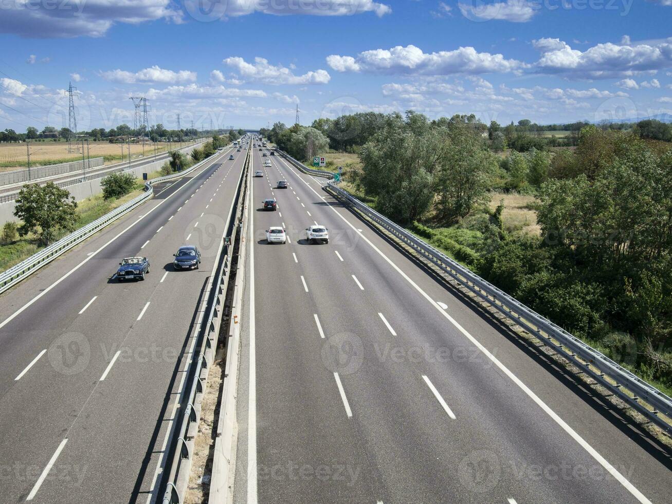 cars trucks person and stocks on motorway photo