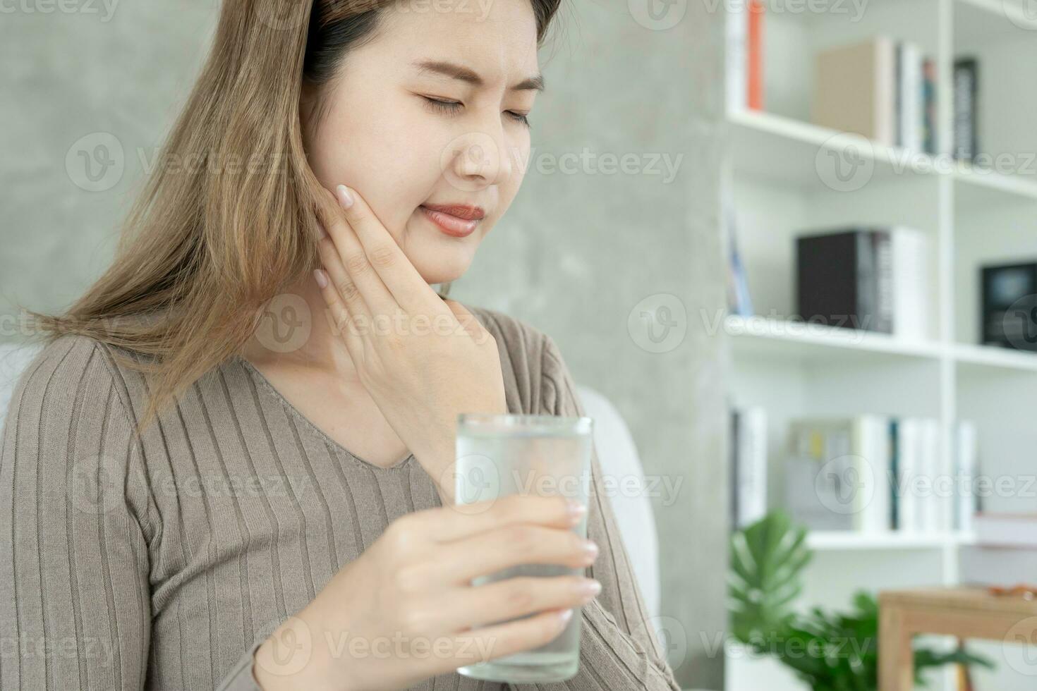 Asian woman feel sensitive teeth after drinking cold, female suffer tooth, decay problems, dental care, tooth extraction, decay problem, bad breath, Gingival Recession, Oral Hygiene instruction photo