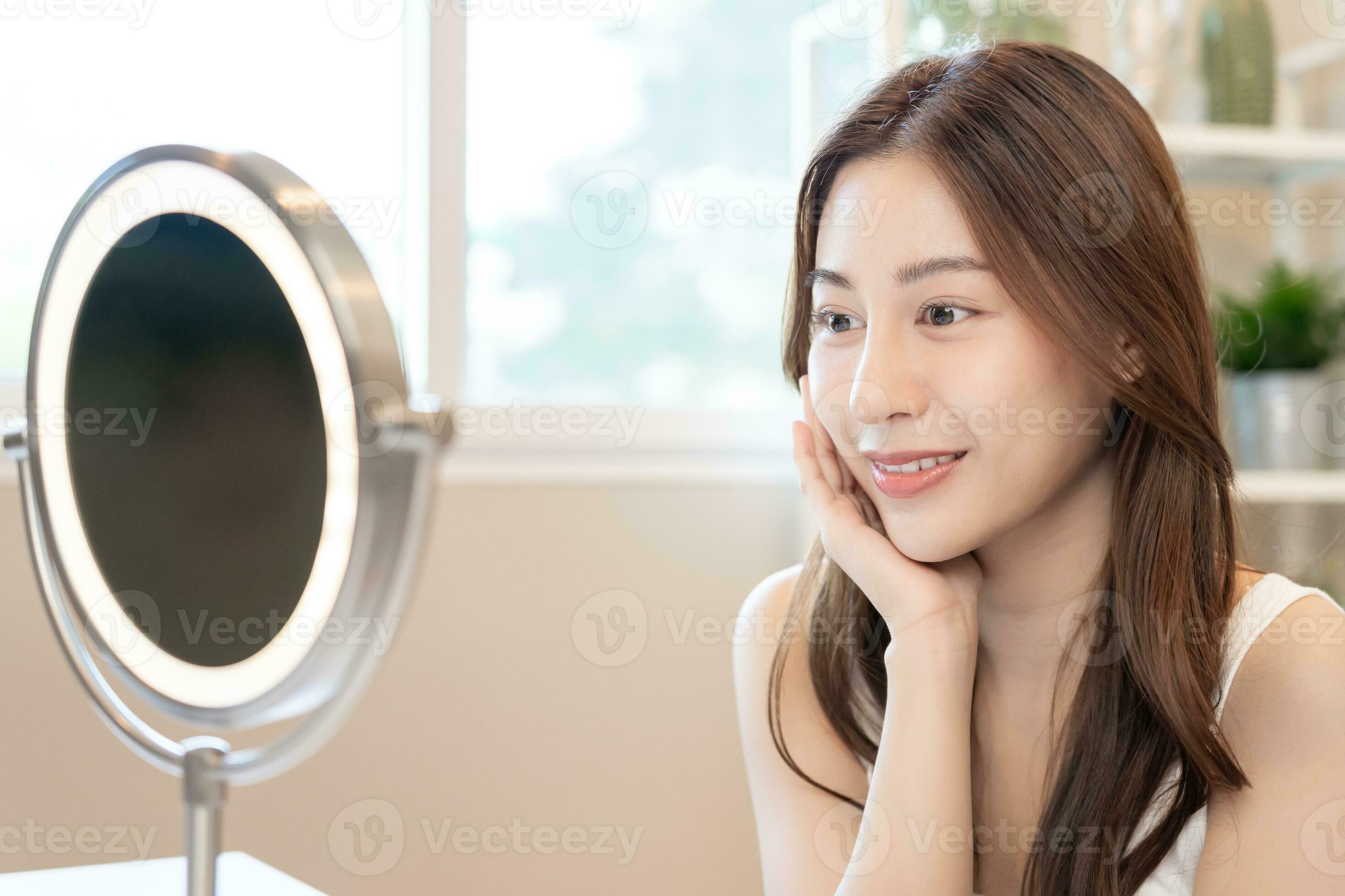 Beautiful Asian woman sit in front of a mirror. face of a healthy woman