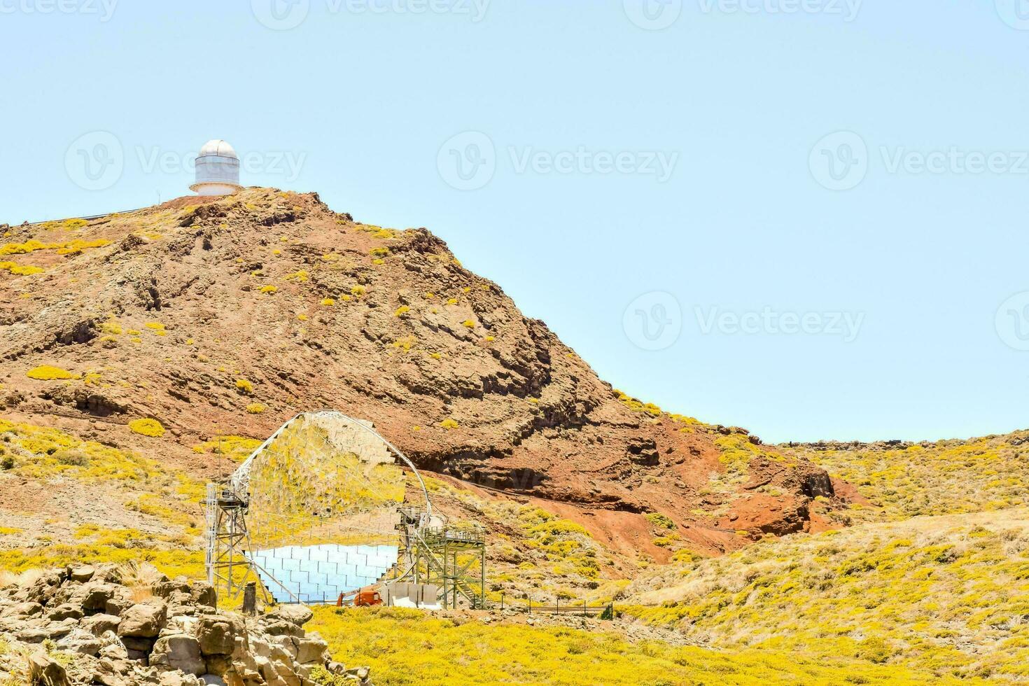 the observatory is on top of a mountain with a white dome photo