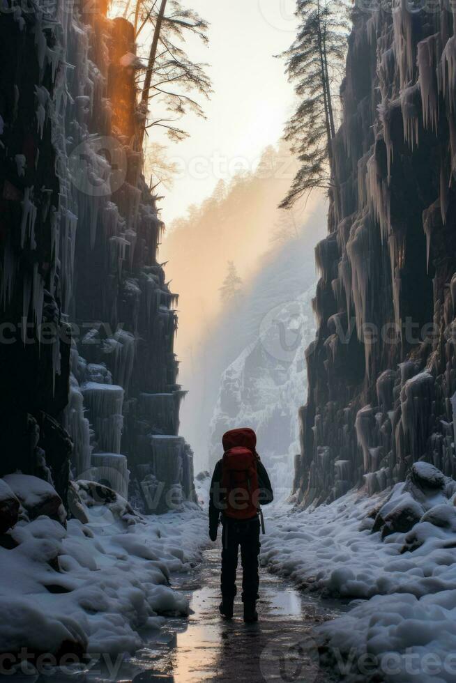 Frozen solitude fearless climber navigates serene yet treacherous icy waterfall photo