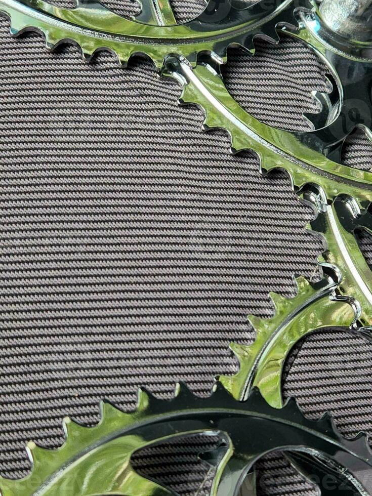 Bicycle sprockets. Bicycle stars on a fabric background. Bike parts photo