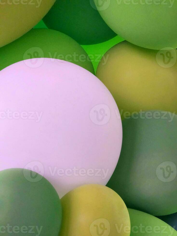 Festive background from balloons. Green balloons. Abstract background photo