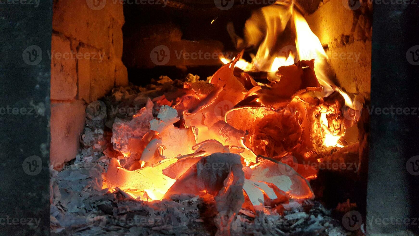 Heat in the stove. Coals and ashes in the fireplace photo