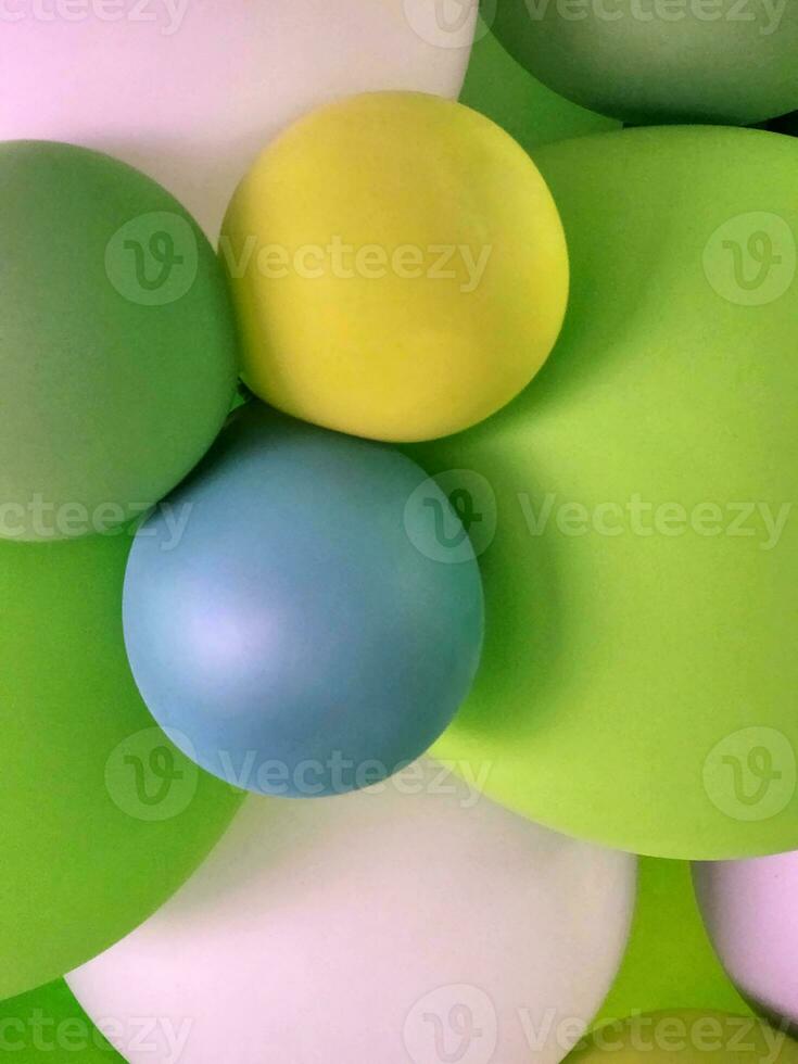 Festive background from balloons. Green balloons. Abstract background photo