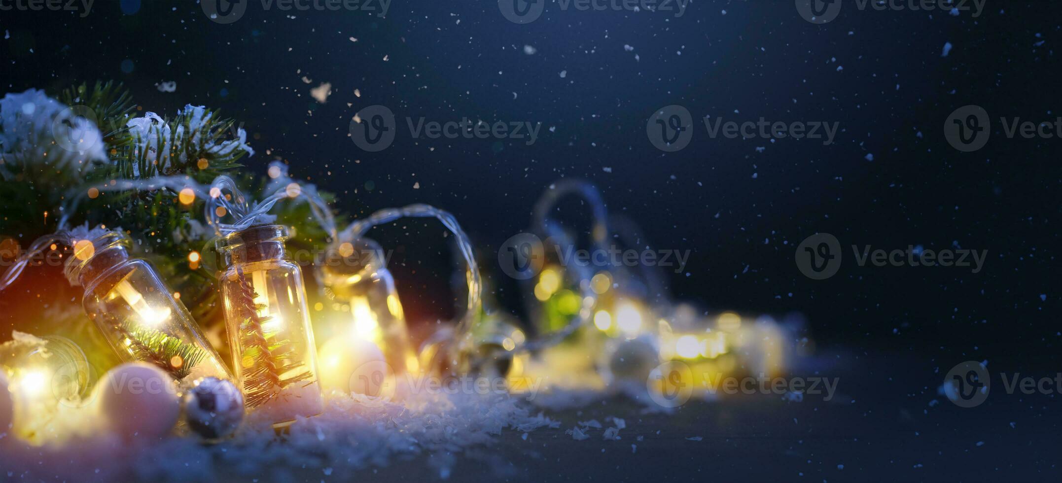 Art Merry Christmas and Happy Holidays greeting card, frame, banner. New Year. Noel. Christmas light ornaments on blue snowy background. Winter xmas holiday theme. photo
