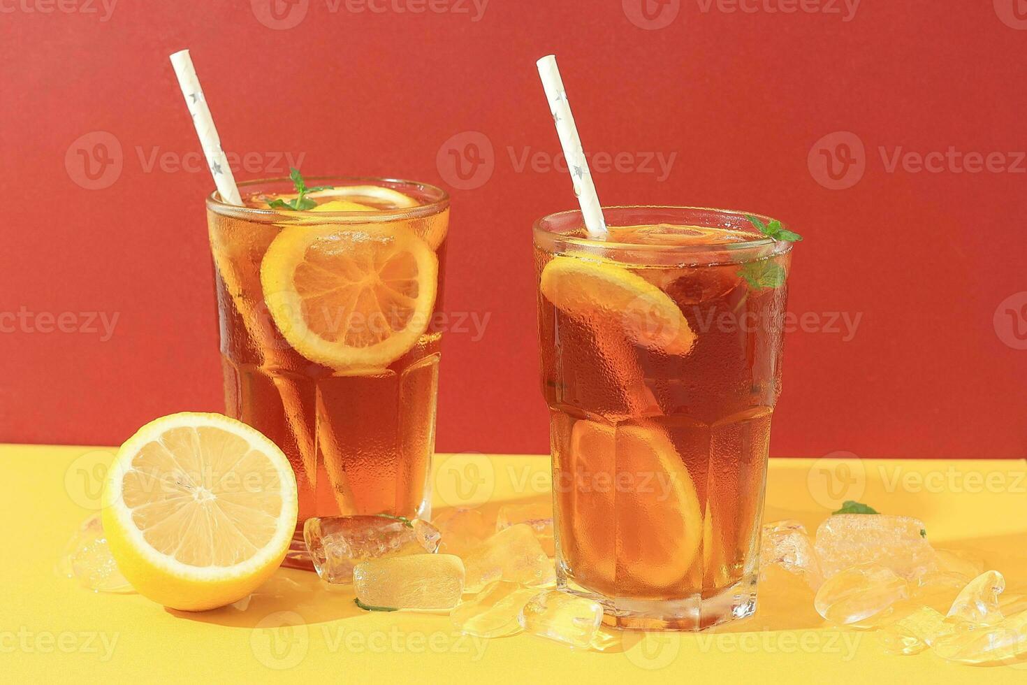 Long Island Iced Tea Cocktail with Vodka, Rum, Tequila, Gin, Liquor, Lemon Juice, Cola, and Ice photo