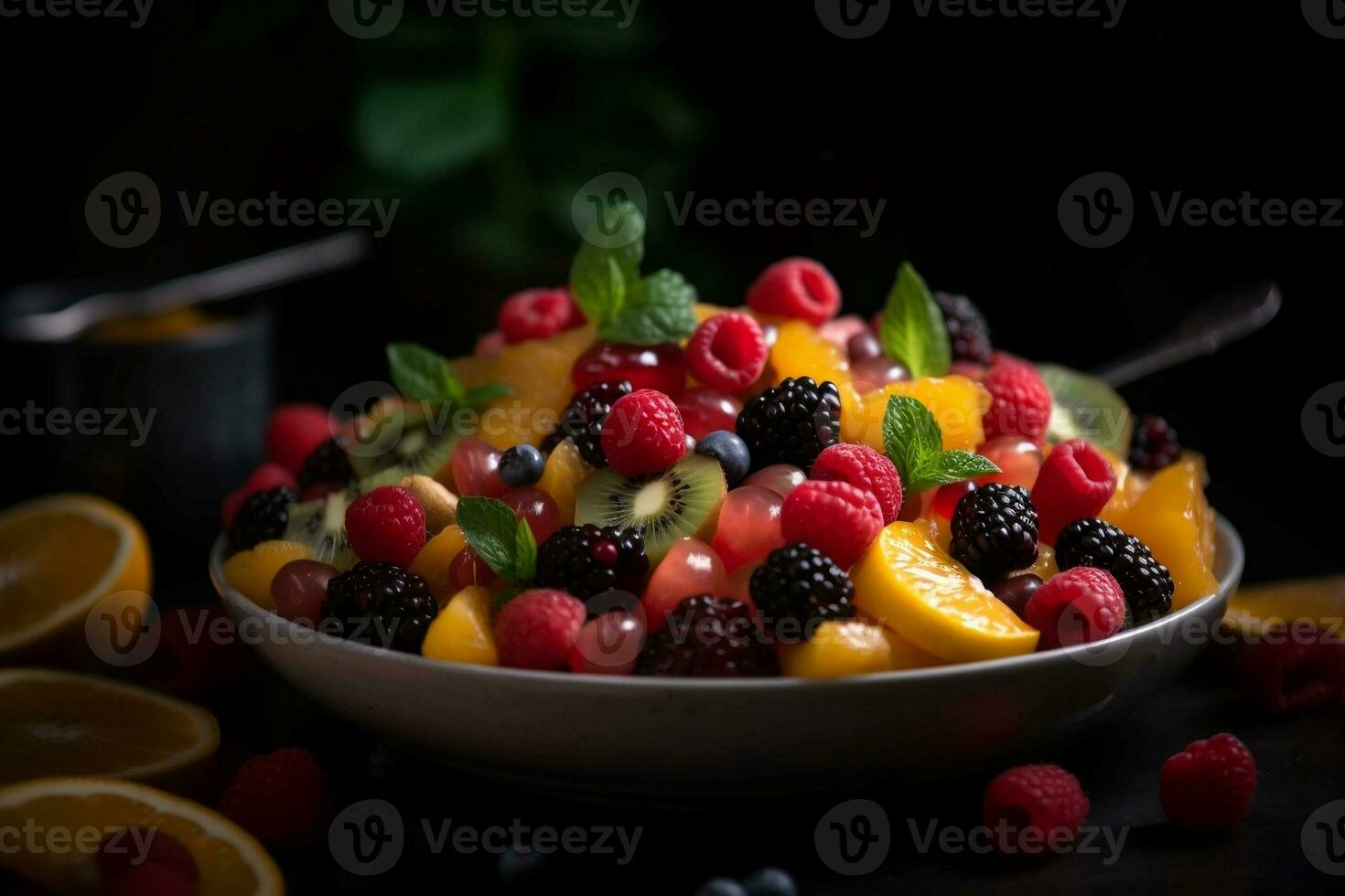 Healthy fruit salad with fresh fruits and berries in a bowl. photo