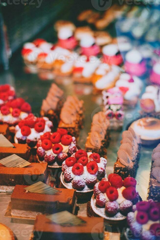 Cakes on the counter of a cafe in Paris, France. photo