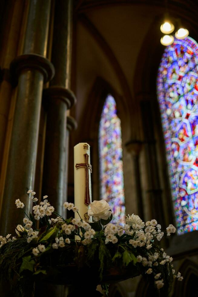 Lincoln, Lincolnshire, UK,  September 19. Candle and flowers in the Cathedral in Lincoln, Lincolnshire on September 19, 2023 photo