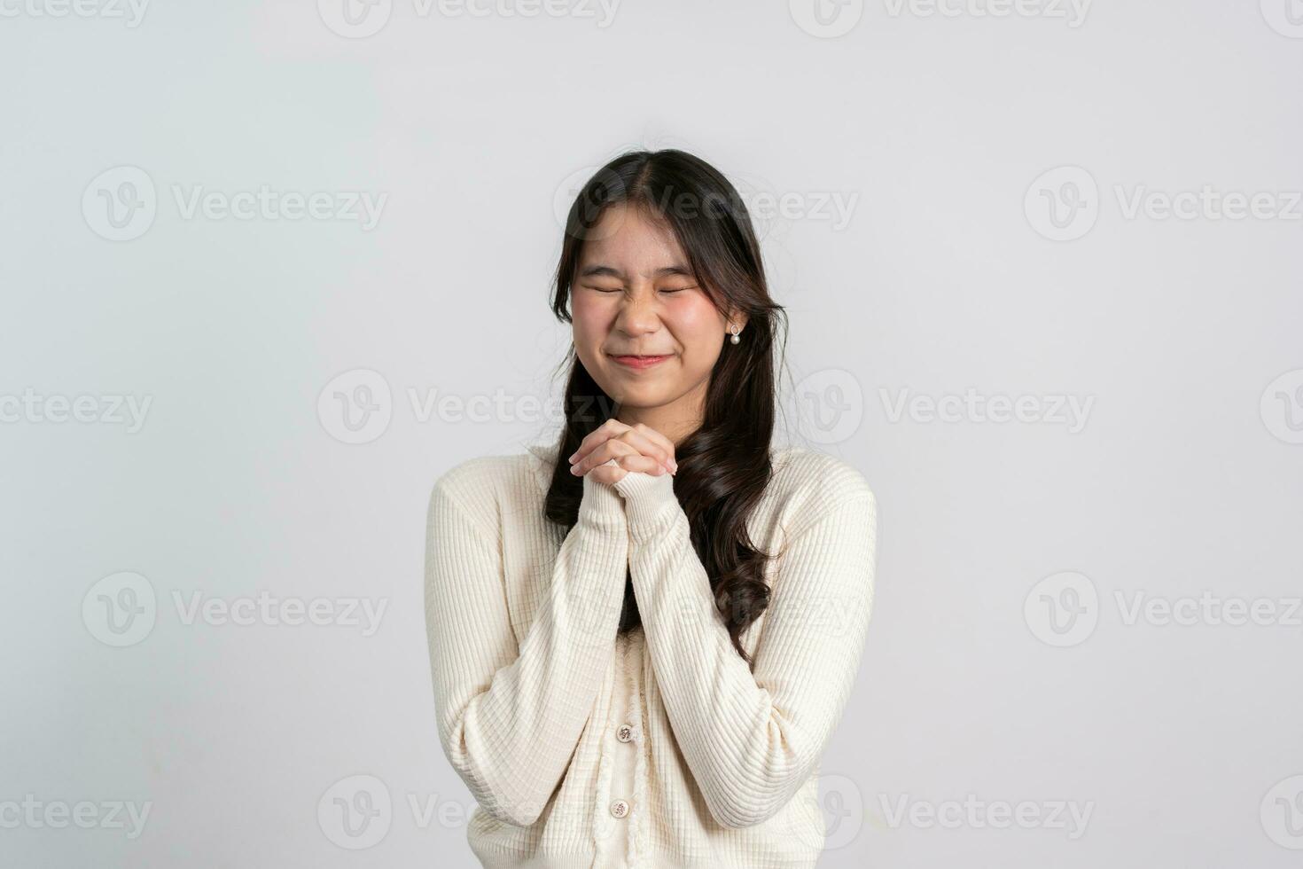 Happy cheerful young Asian girl with long light hair smiling brightly feeling happy with a positive expression, joyful surprise funky, Female in black with a big smile isolated on white background. photo