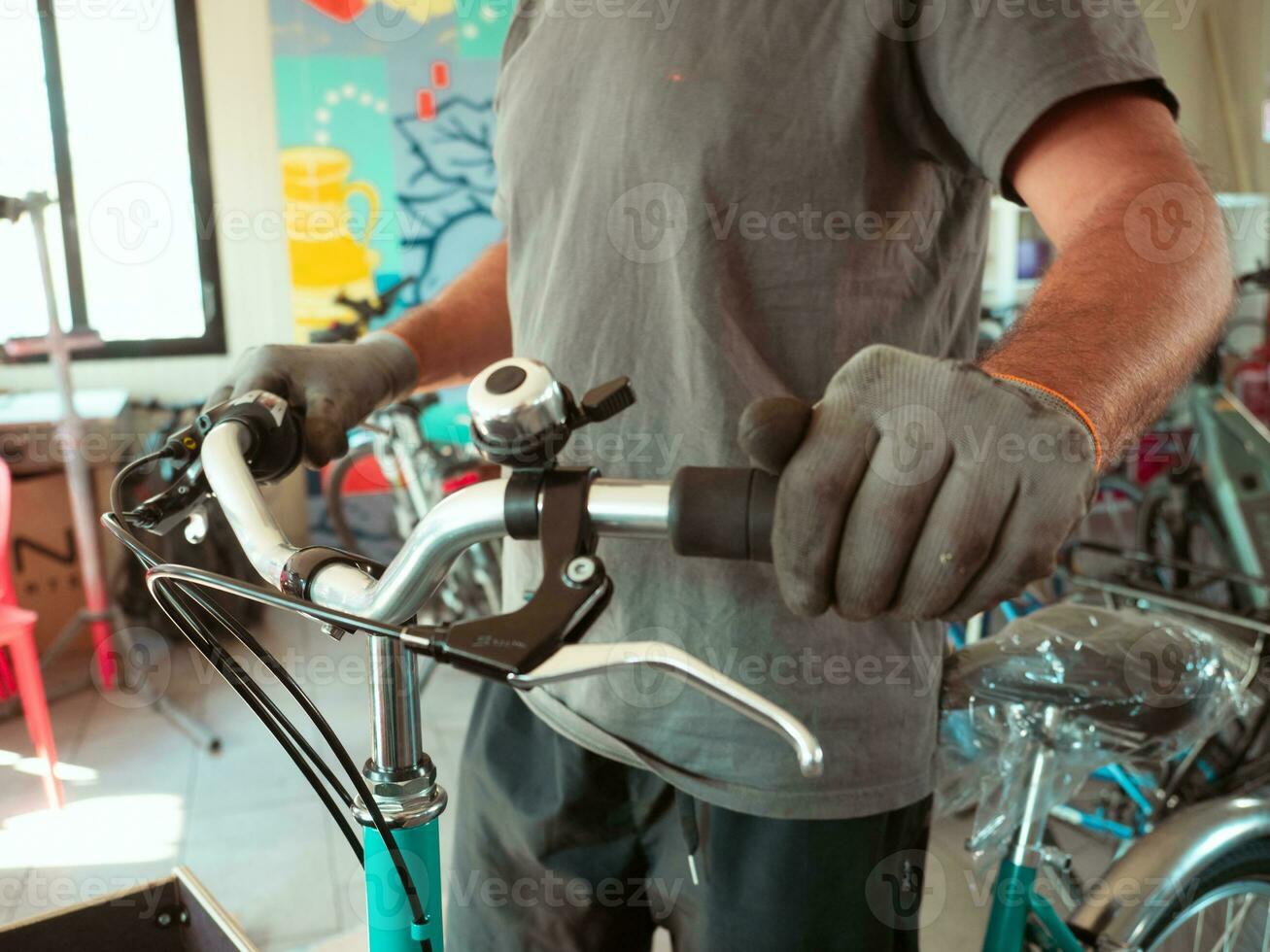 at the bike shop store and repair , mechanic expert repairs restore bycicle handlebar and brake photo