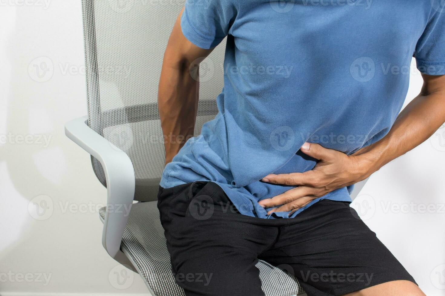 A man sitting farting on the chair photo