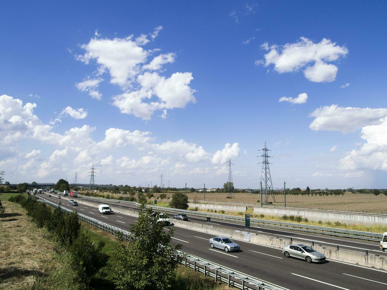 cars trucks person and stocks on motorway photo