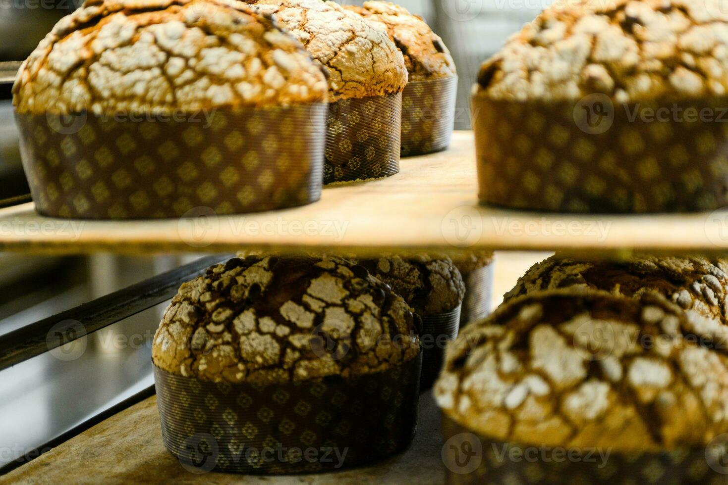 pastry baker artisan baking small group of italian panettone sweet bread typical for christmas time photo