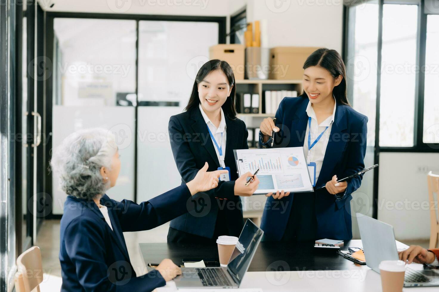 Business team discuss at meeting room. working together with laptop ,tablet and smart phone on desk Financial accountant , planner , meeting , introduction concept. photo