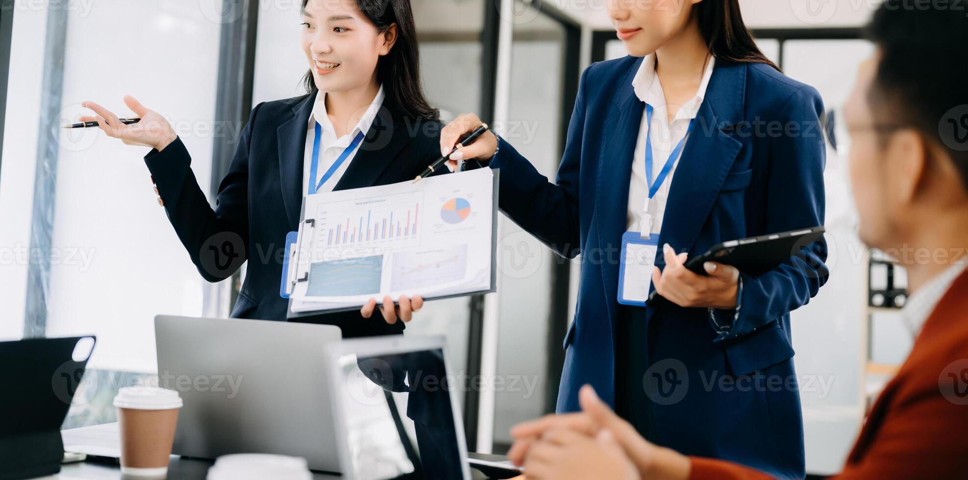 Business team discuss at meeting room. working together with laptop ,tablet and smart phone on desk Financial accountant , planner , meeting , introduction concept. photo