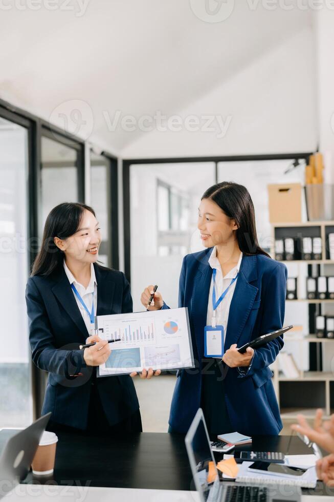 Business team discuss at meeting room. working together with laptop ,tablet and smart phone on desk Financial accountant , planner , meeting , introduction concept. photo