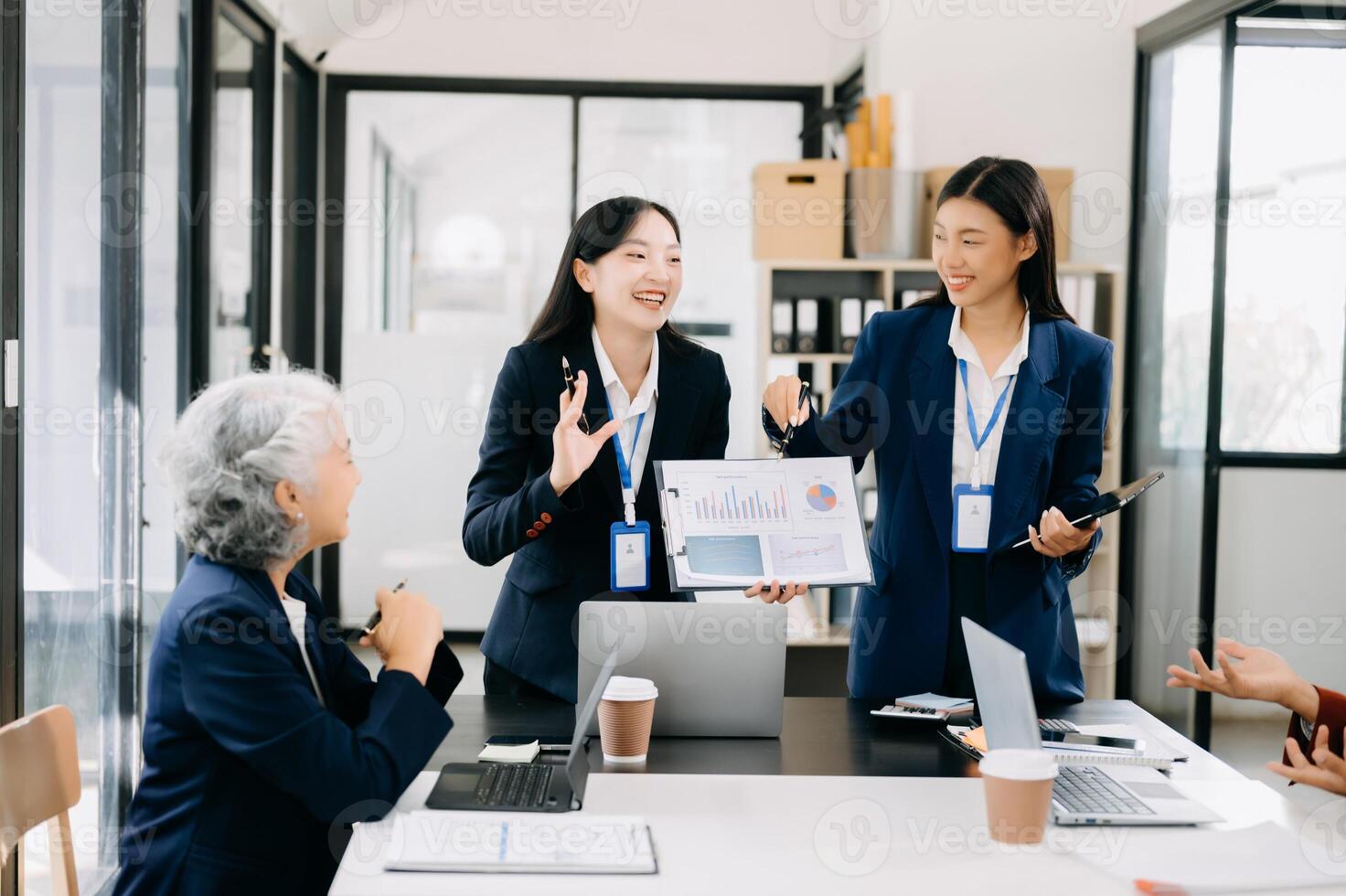 Business team discuss at meeting room. working together with laptop ,tablet and smart phone on desk Financial accountant , planner , meeting , introduction concept. photo