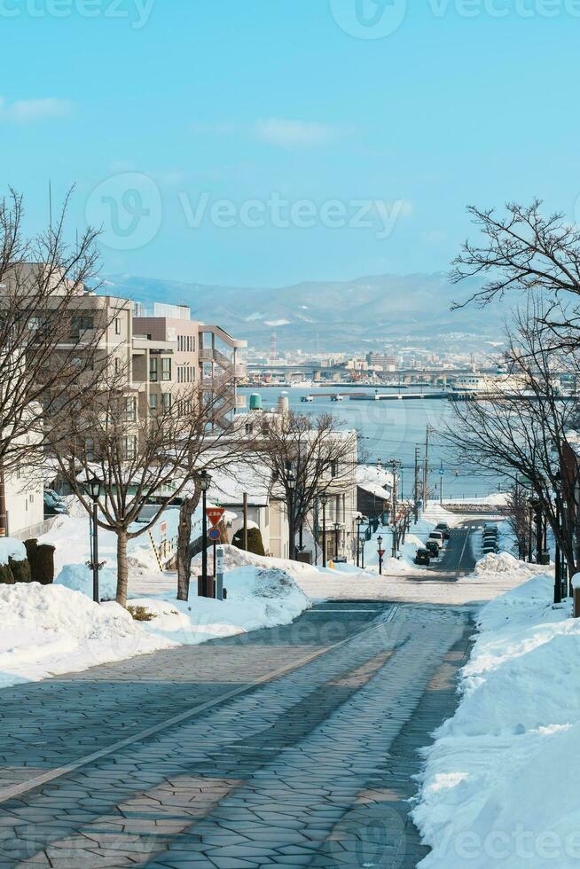 Hachiman Zaka Slope with Snow in winter season. landmark and popular for attractions in Hokkaido, Japan. Travel and Vacation concept photo