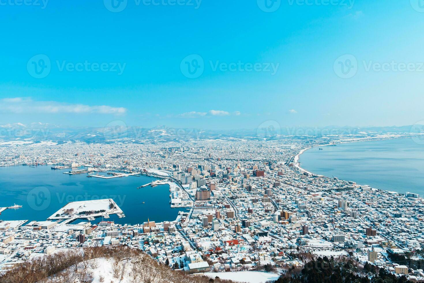 Beautiful landscape and cityscape from Hakodate Mountain with Snow in winter season. landmark and popular for attractions in Hokkaido, Japan.Travel and Vacation concept photo