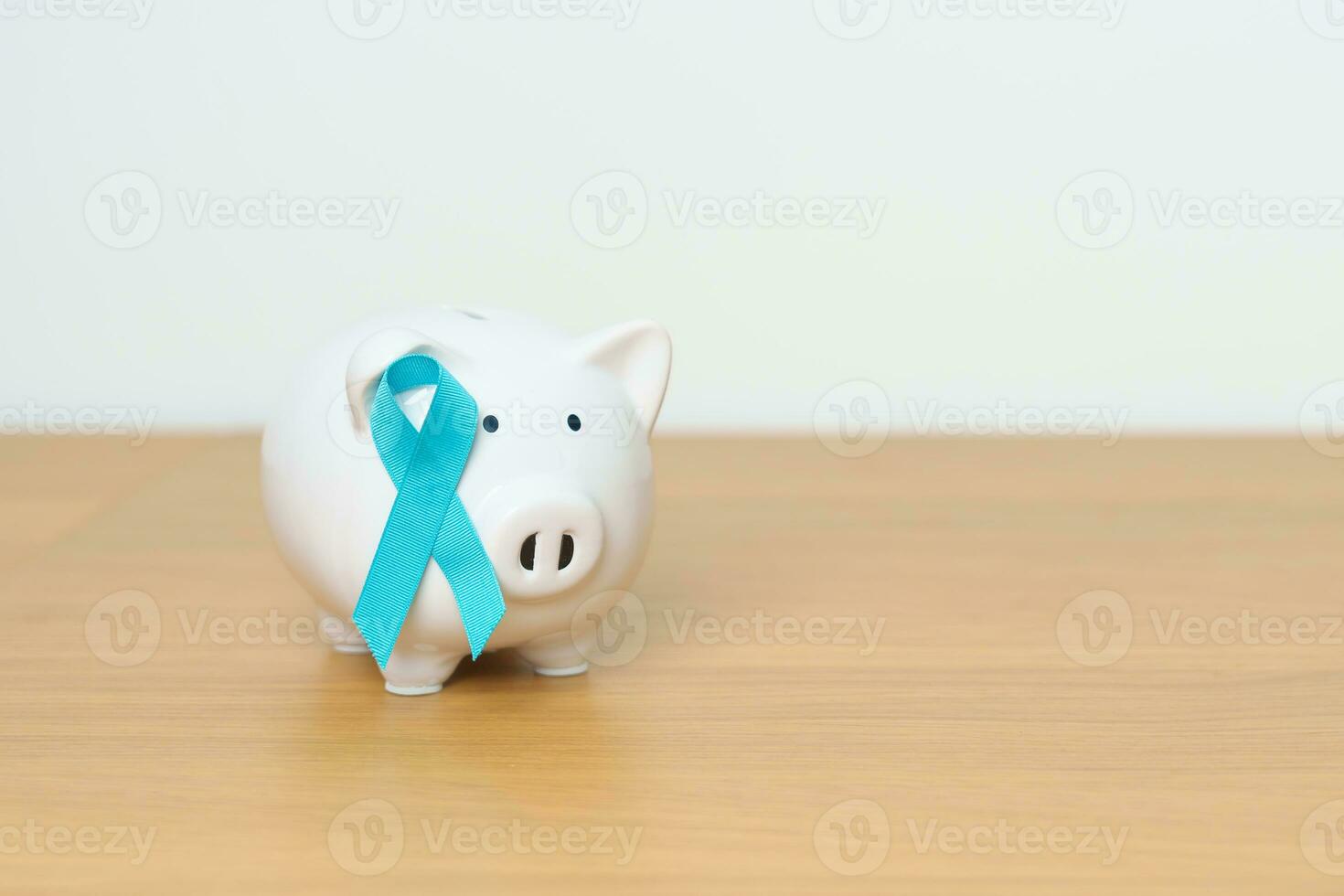 Blue November Prostate Cancer Awareness month, Blue Ribbon with Piggy Bank for support illness life. Health, Donation, Charity, Campaign, Money Saving, Fund, International men, Father and Diabetes photo