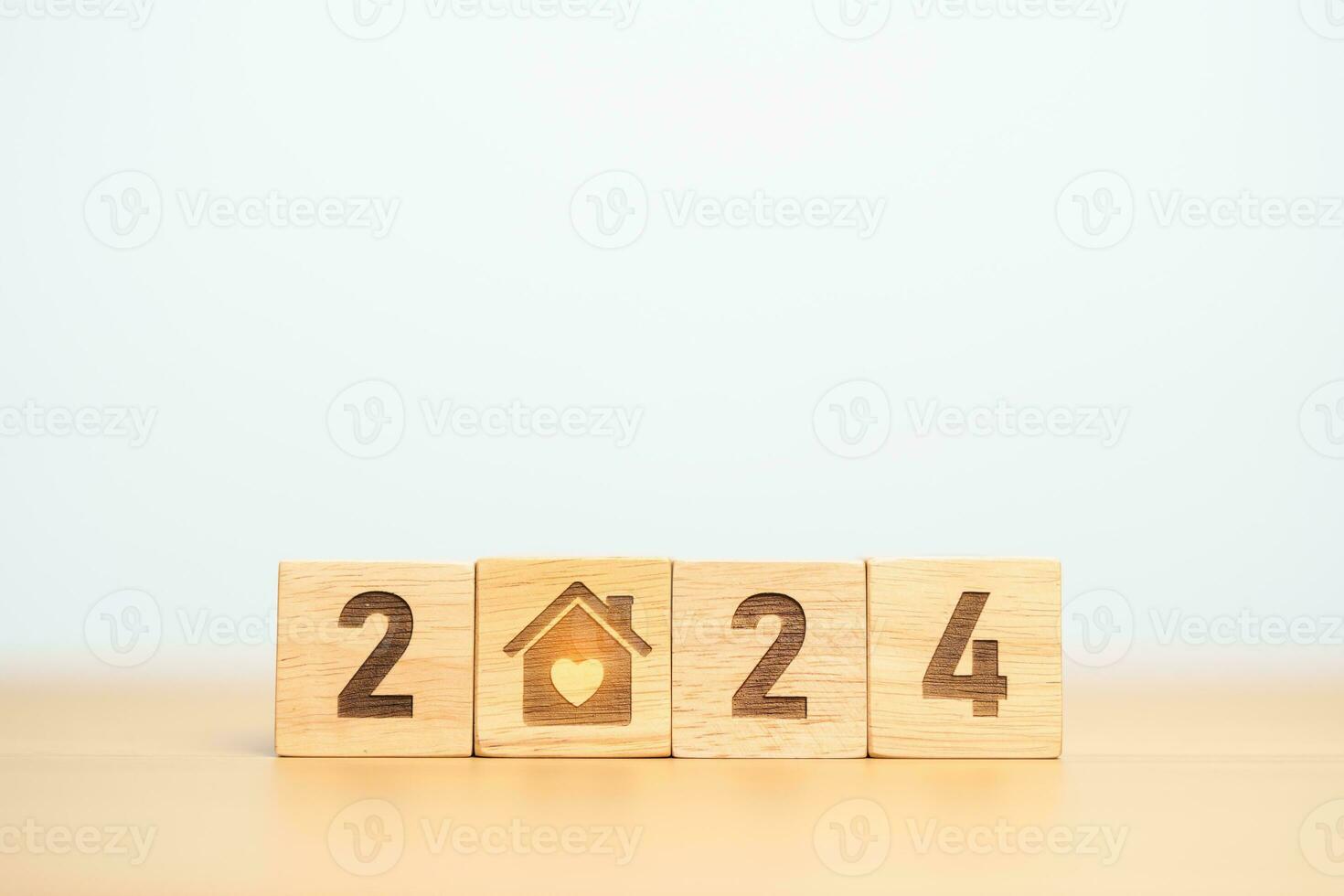 Happy New Year 2024 with Home and Heart block. Property investment, House Mortgage, Real Estate tax, homeless, donation, Financial and happy family concepts photo