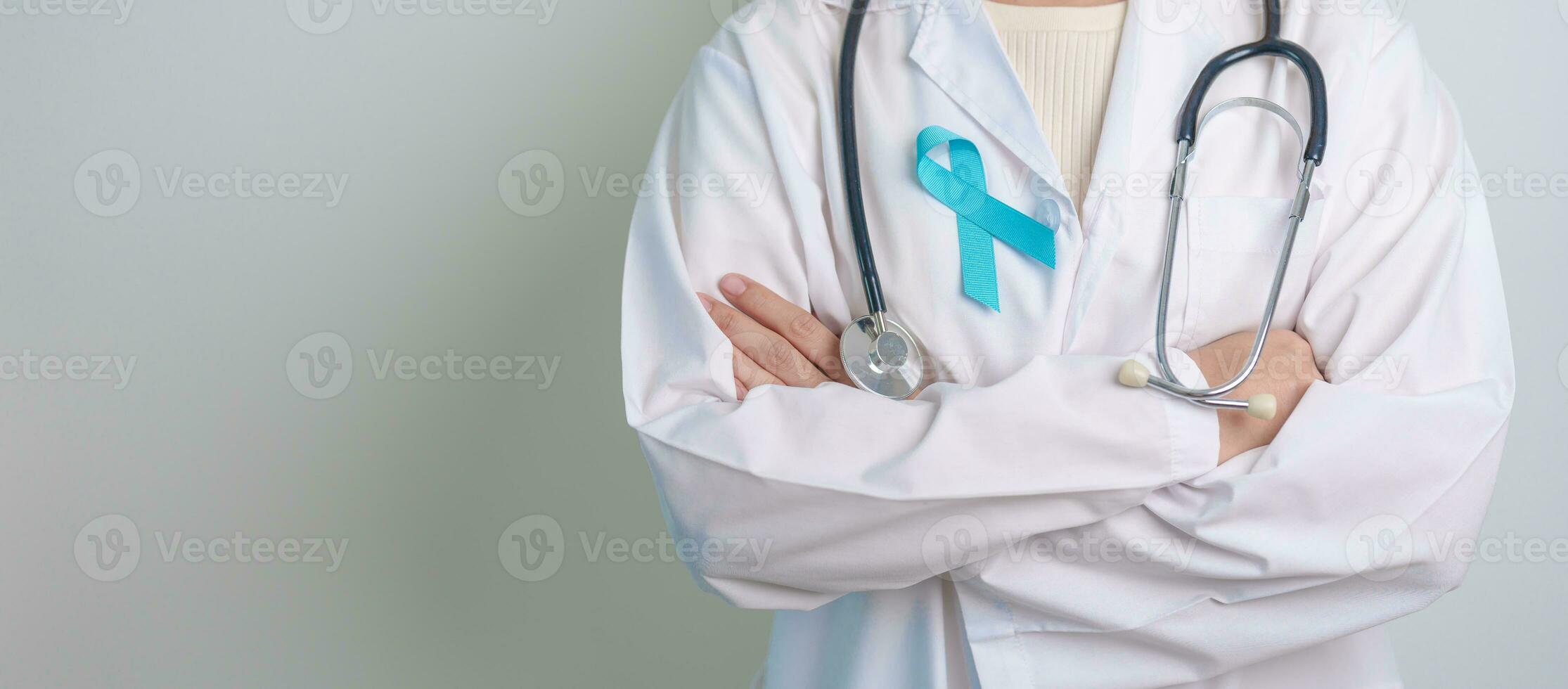 Blue November Prostate Cancer Awareness month, Doctor with Blue Ribbon in hospital for support people life and illness. Healthcare, International men, Father, Diabetes and World cancer day photo