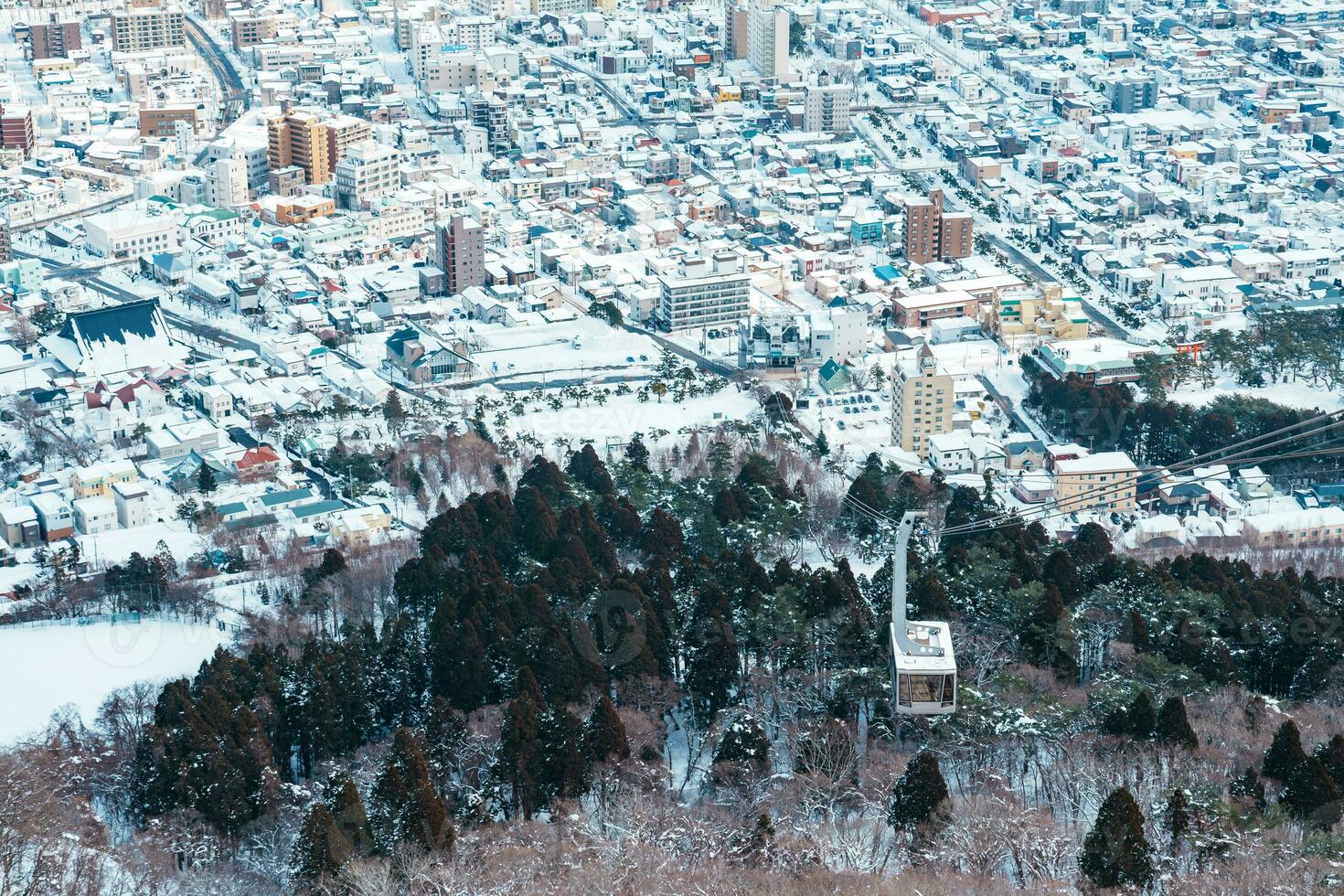 Beautiful landscape and cityscape from Hakodate Mountain with Snow in winter season. landmark and popular for attractions in Hokkaido, Japan.Travel and Vacation concept photo