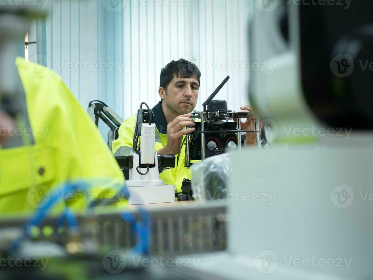 man male person people work job occupation technology education study robot machine learning maintenance factory manufacturing technician engineer tool equipment futuristic system line plant welding photo