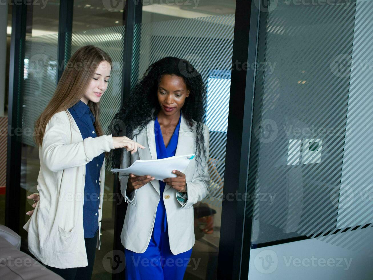 Female woman businesswoman lady person people teamwork group wear suit talk speak discussion explain work job coaching strategy idea paper note meeting copy space black african american history month photo