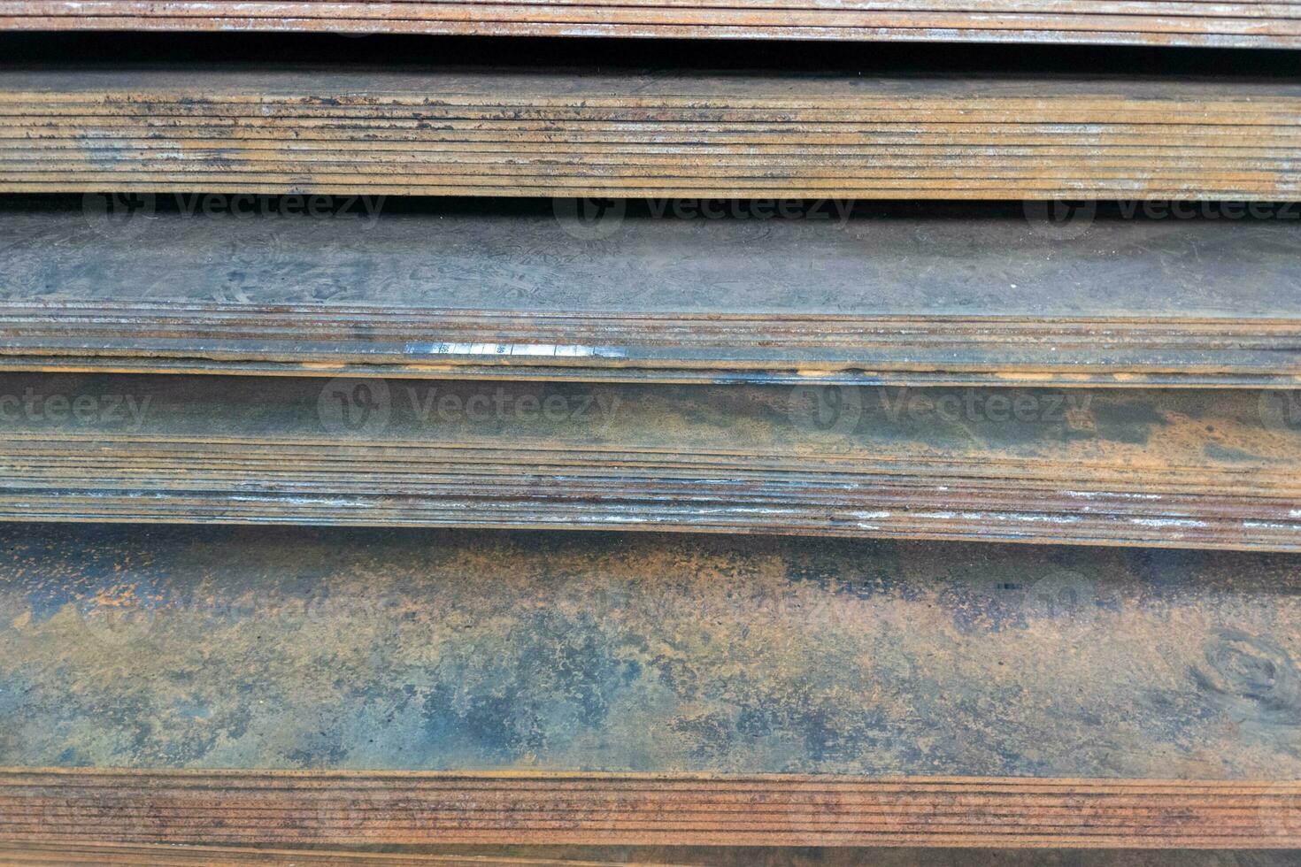 stack of mild steel sheets, full-frame close-up view with selective focus photo