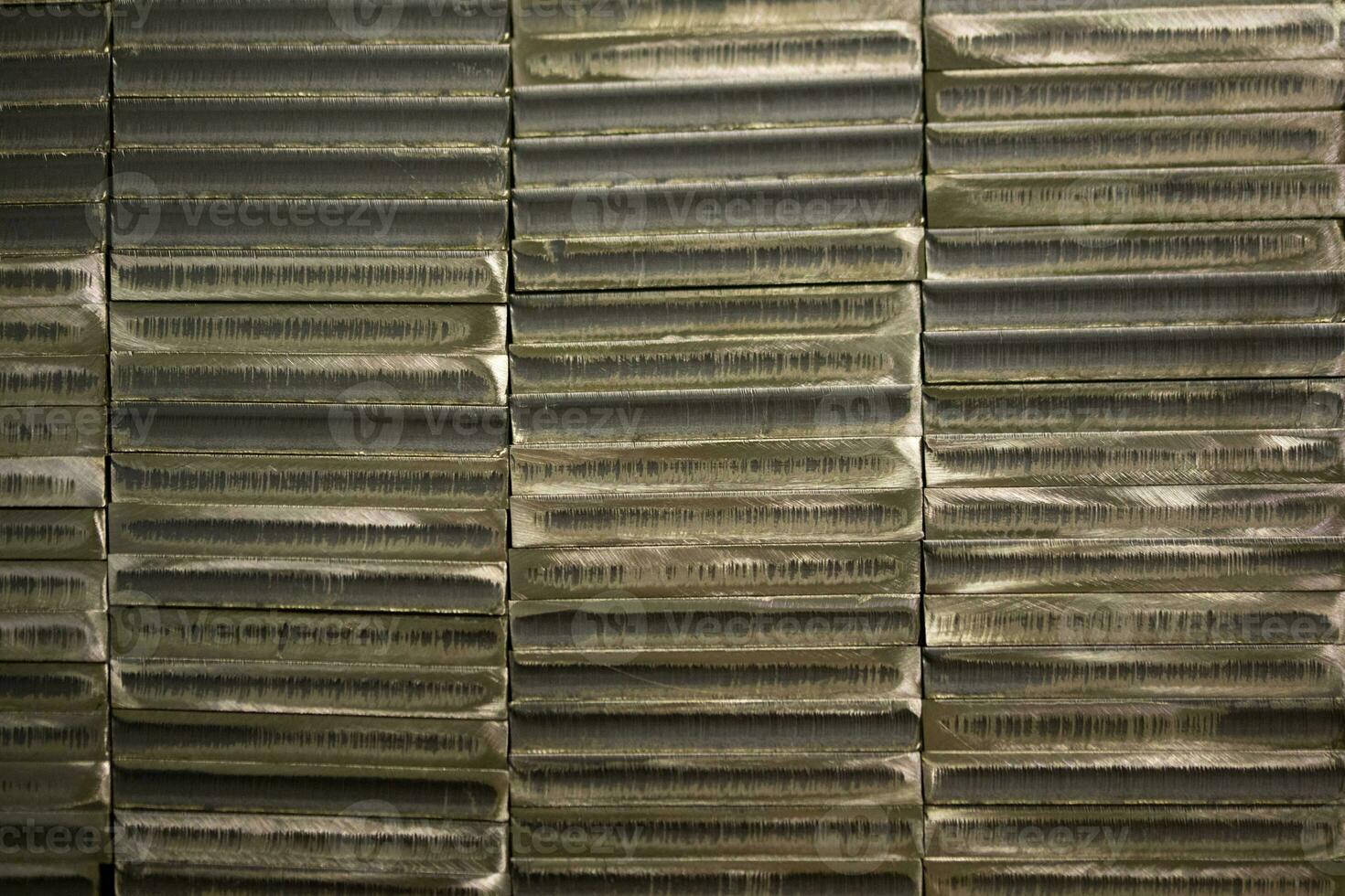 stack of laser cut steel billets - closeup texture and background photo