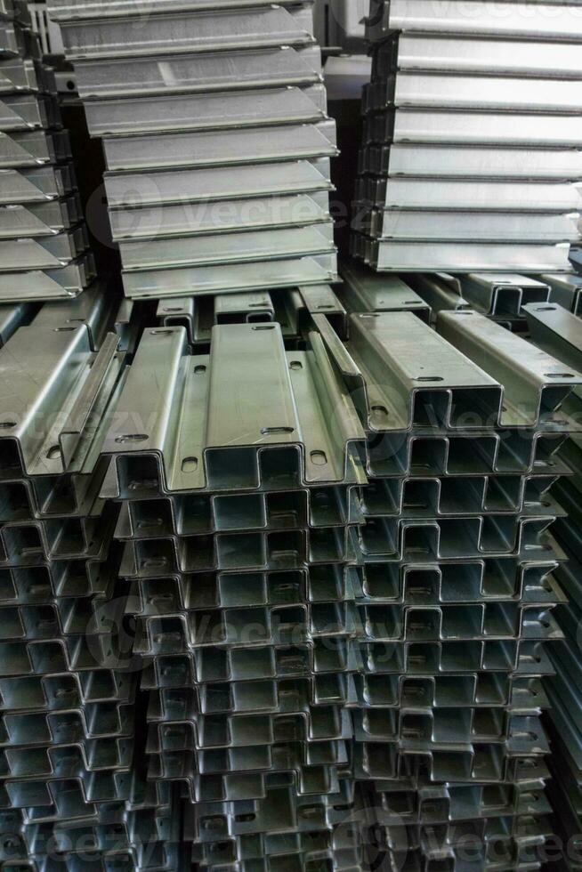 full frame view on stacks of profile bent sheet metal parts photo
