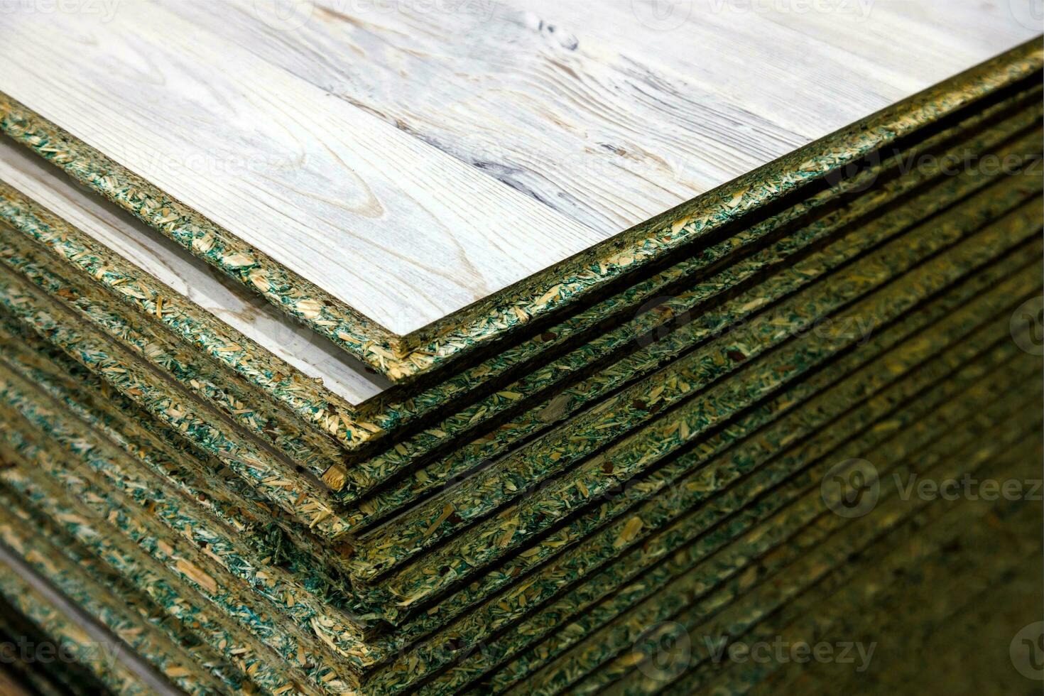 stacks of tongue and groove water resistant OSB compressed sawdust sheets photo