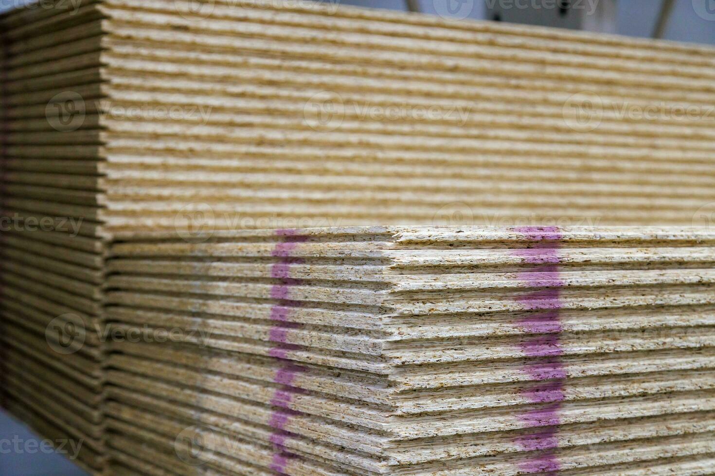 stacks of tongue and groove water resistant OSB compressed sawdust sheets photo