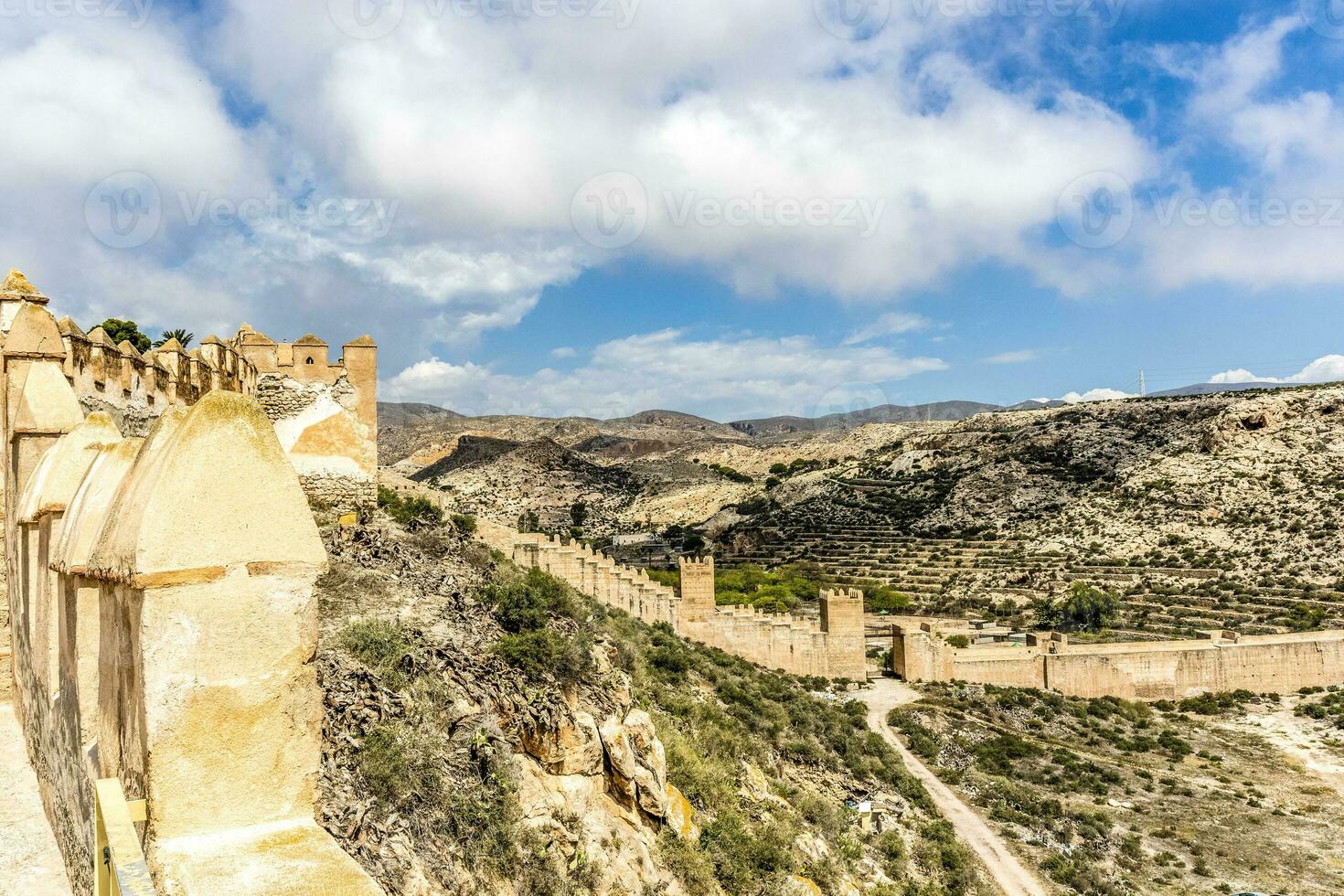 Jayran Wall - a Moorish wall-  and Cerro San Cristobal Hill in Almeria, Andalusia, Spain photo